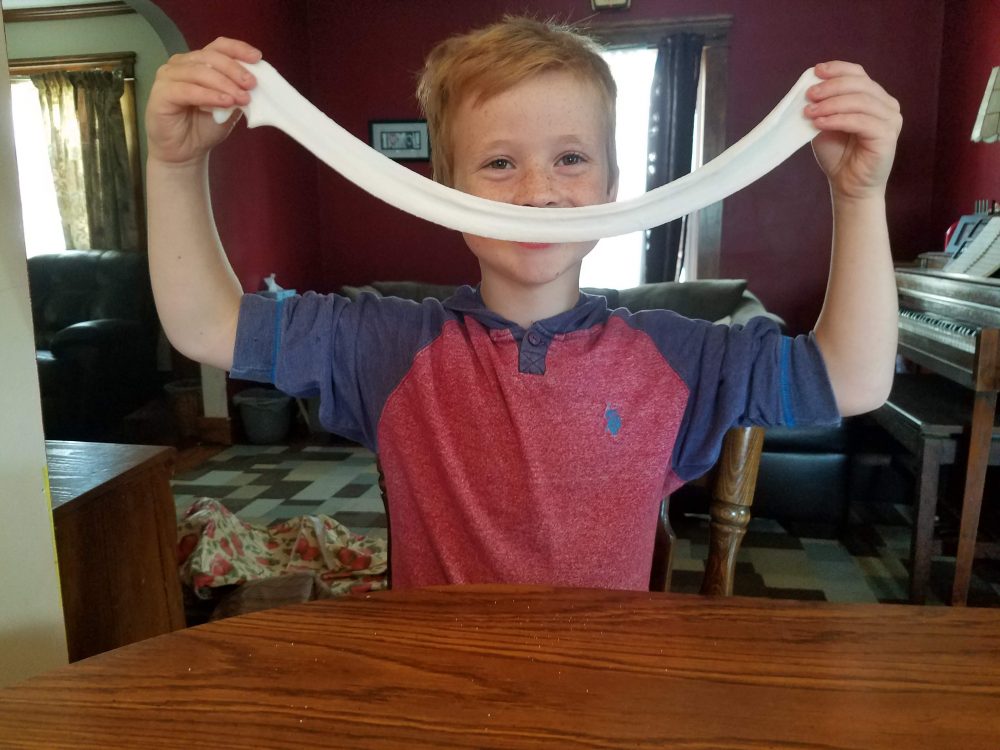 boy holding slime