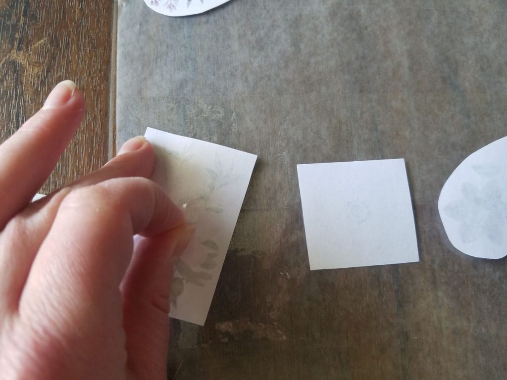 Peeling clear tab from glue dot