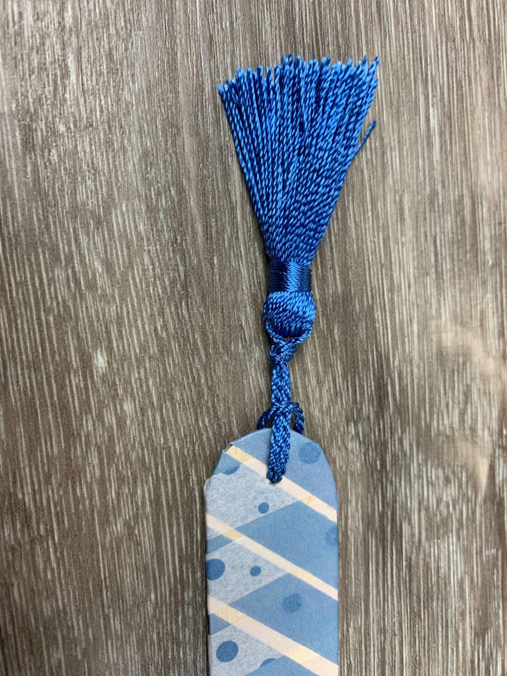 securing the tassel on DIY bookmark