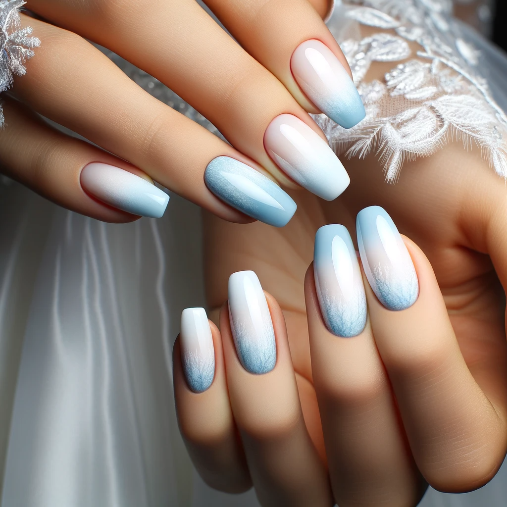 icy blue ombre nails with a gradient from light icy blue at the cuticle to a deeper shade at the tips