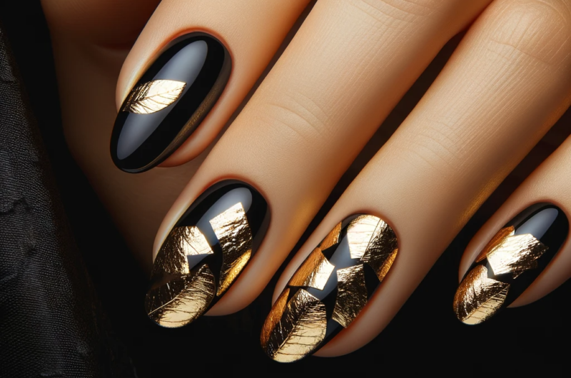 nails with pieces of gold foil against a black background featured