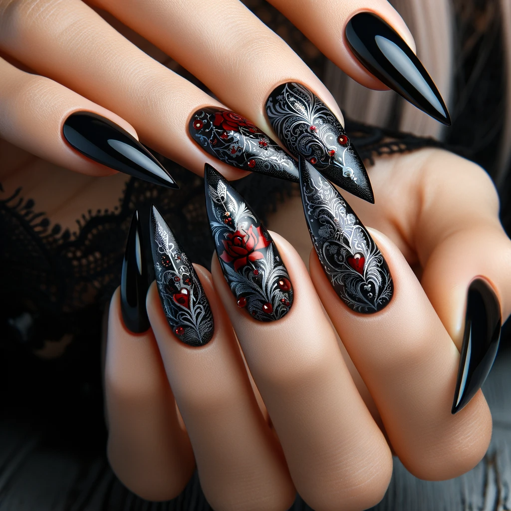 stiletto-shaped nails with deep black polish with silver and red gothic patterns