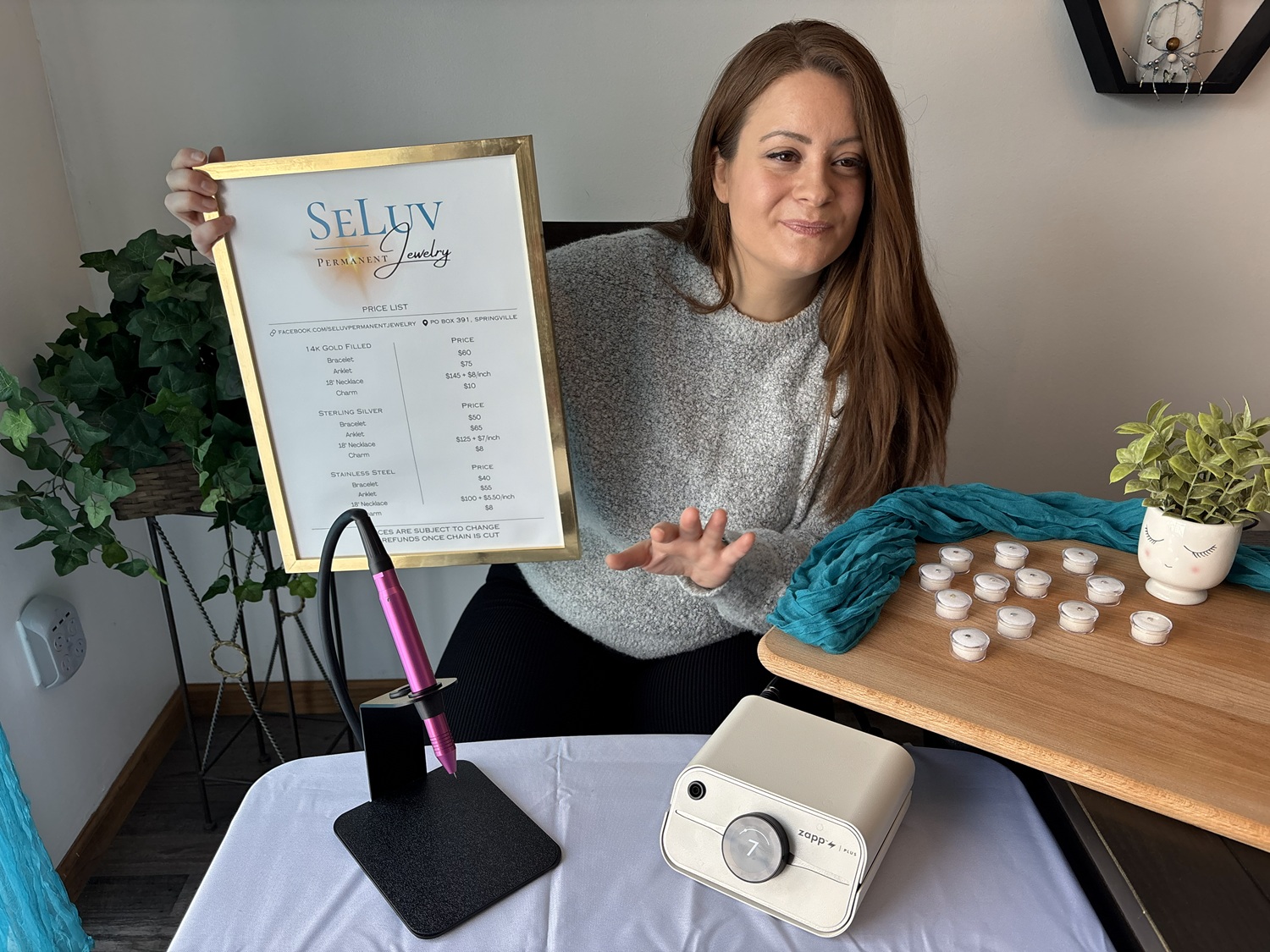Trinity Owen explaining permanent jewelry prices to customer
